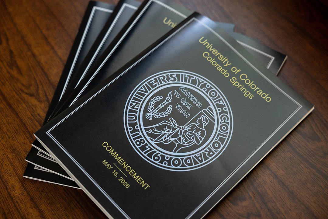 Commencement program covers in a stack