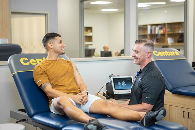UCCS Hybl Center trainer chatting with patient