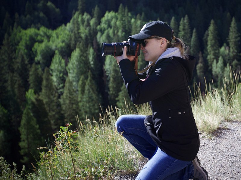 Photo of Gabby Hensley using a camera