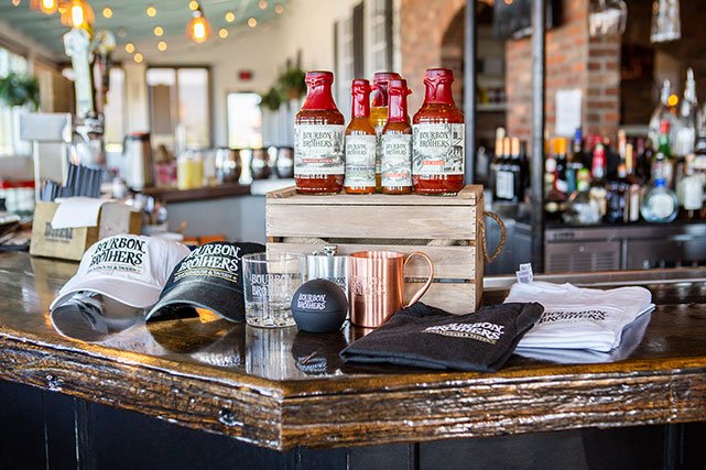 Bourbon Brothers merch on bar top