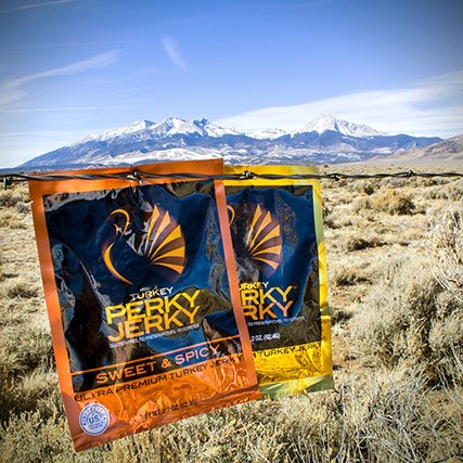 Perky Jerky in front of mountains