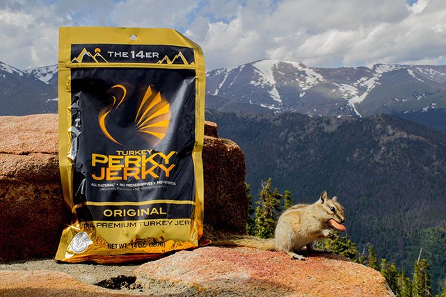 Perky Jerky in the mountains next to a chipmunk